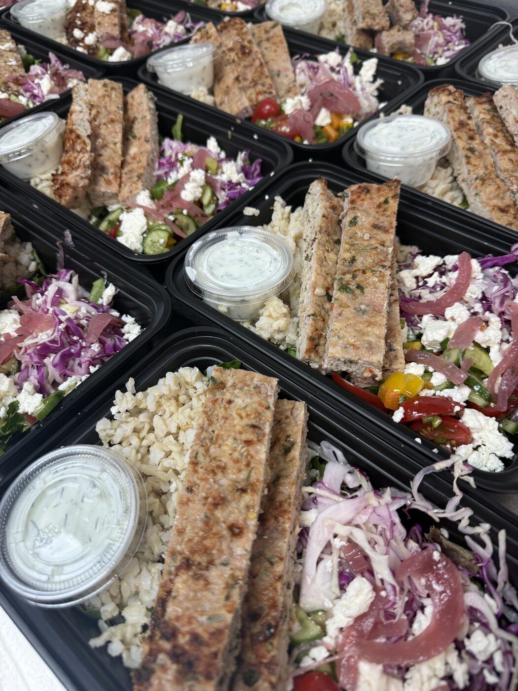 Chicken gyro trays with feta salad, cauliflower rice and tzatziki